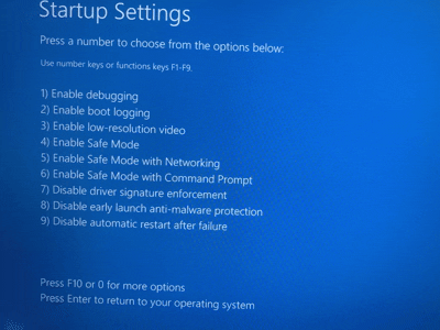 Screenshot of the Startup Settings screen with '4) Enable Safe Mode' highlighted.